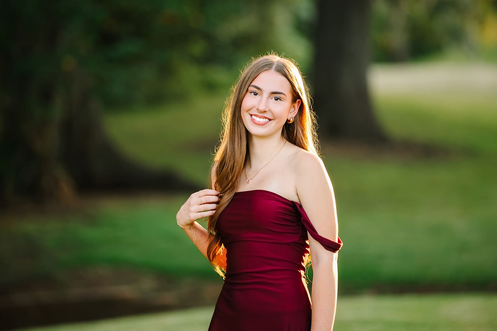 Brazoswood High School student in a burgundy dress before the Homecoming dance in Lake Jackson, Texas